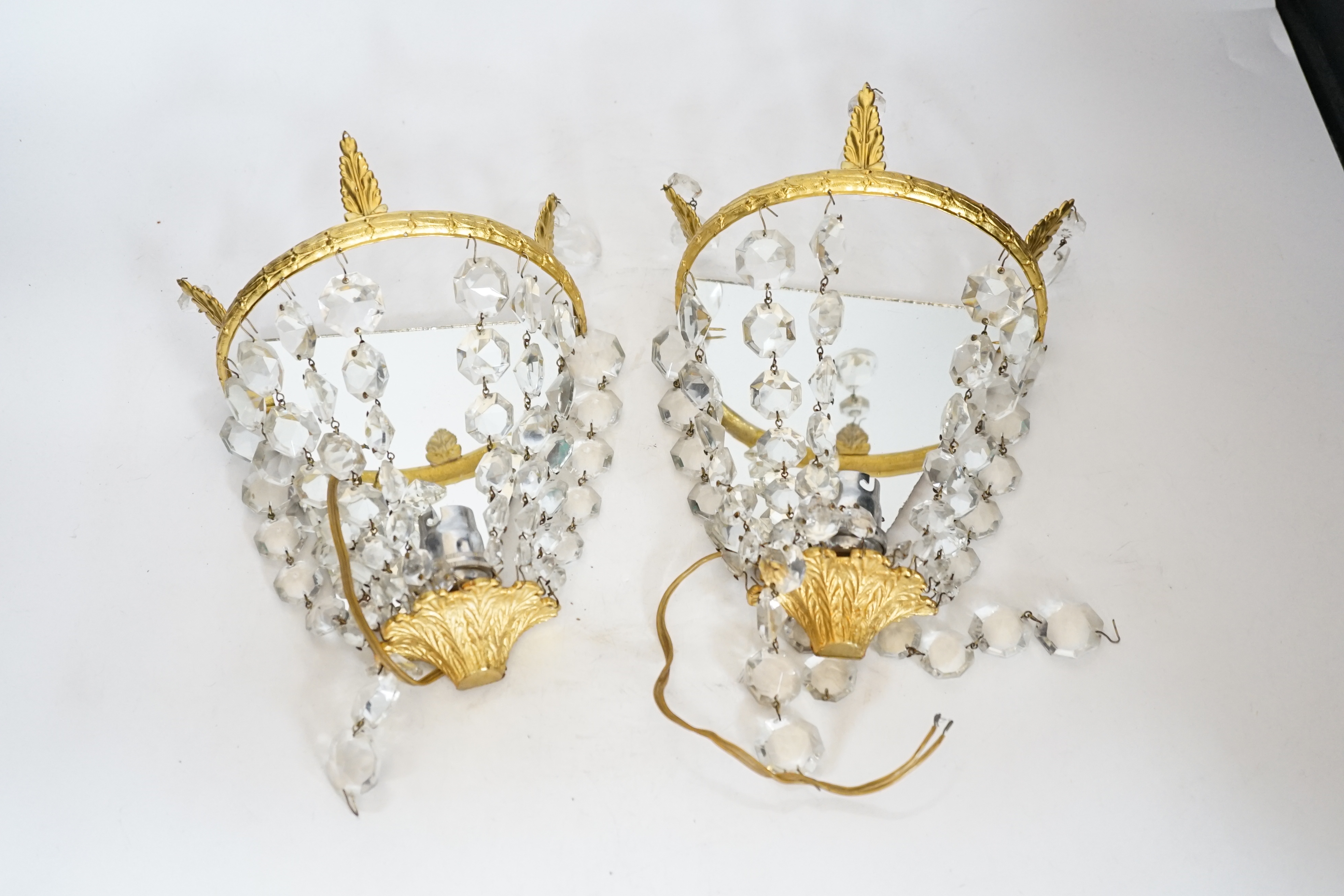 A pair of gilt mounted lustre wall lights, 23cm high